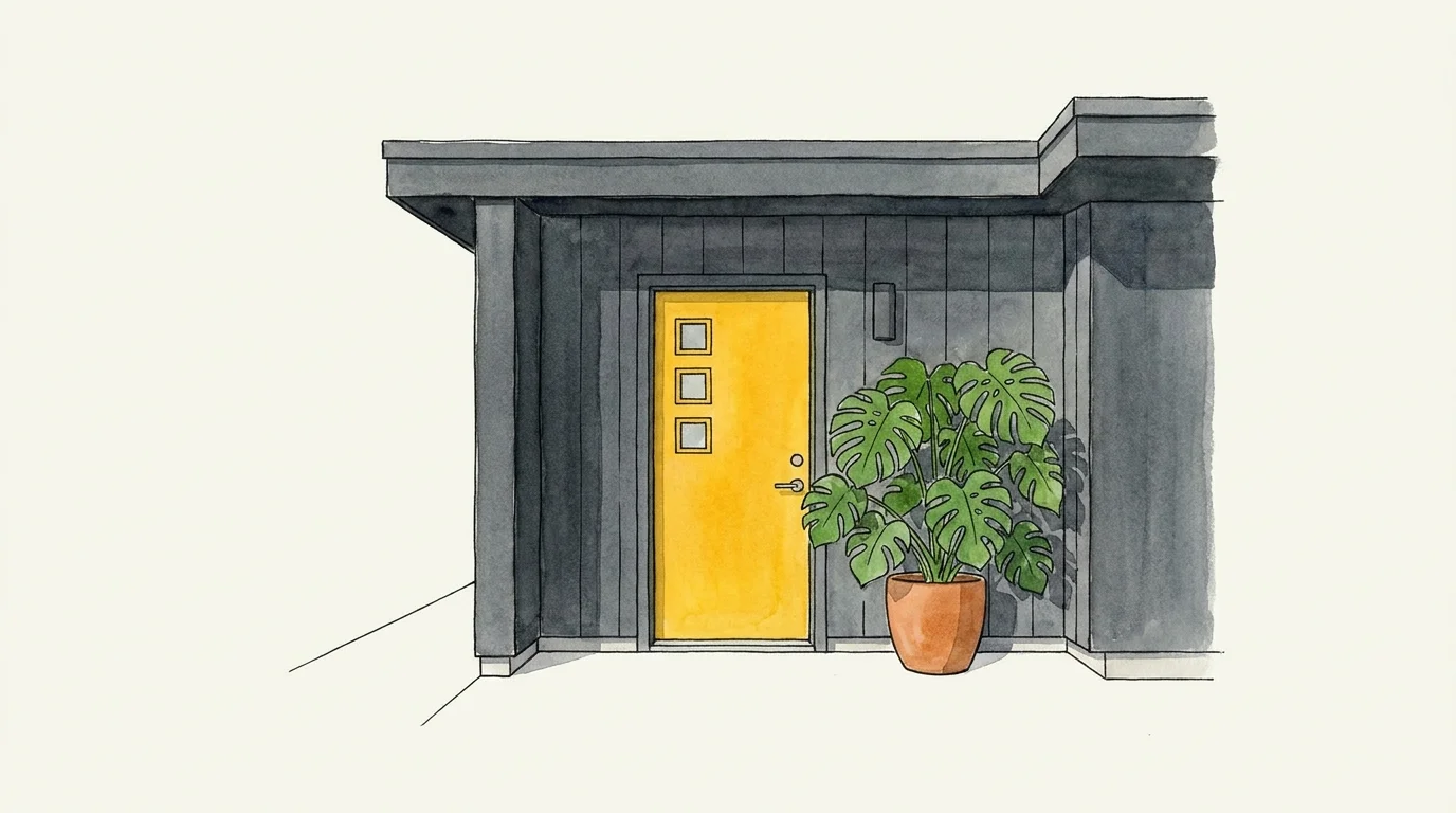 Watercolor painting of a modern grey house with a bright mustard yellow front door.